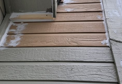 siding with replaced boards before painting