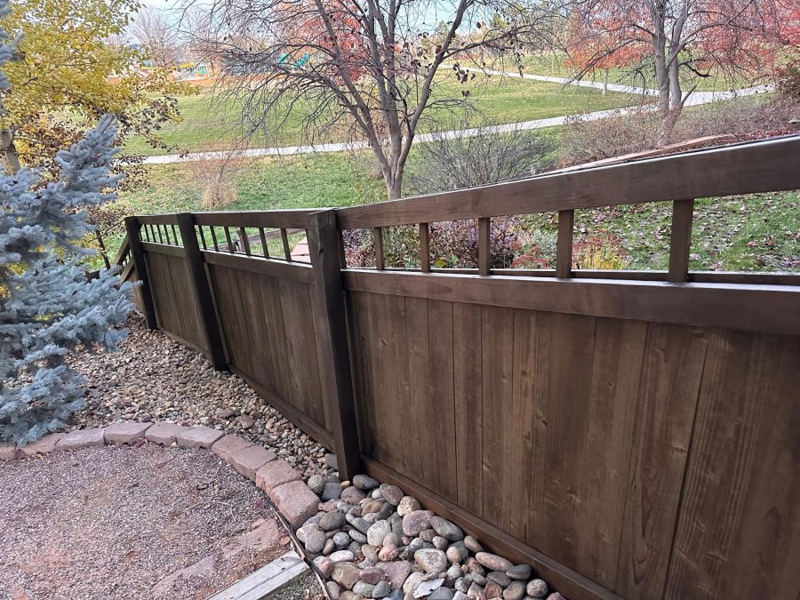 wooden fence with dark stain