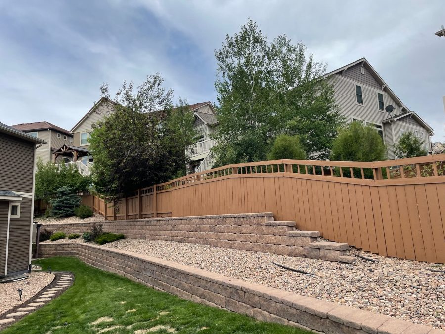 painted fence surrounding house and yard