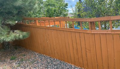 stained wooden privacy fence surrounding residential property