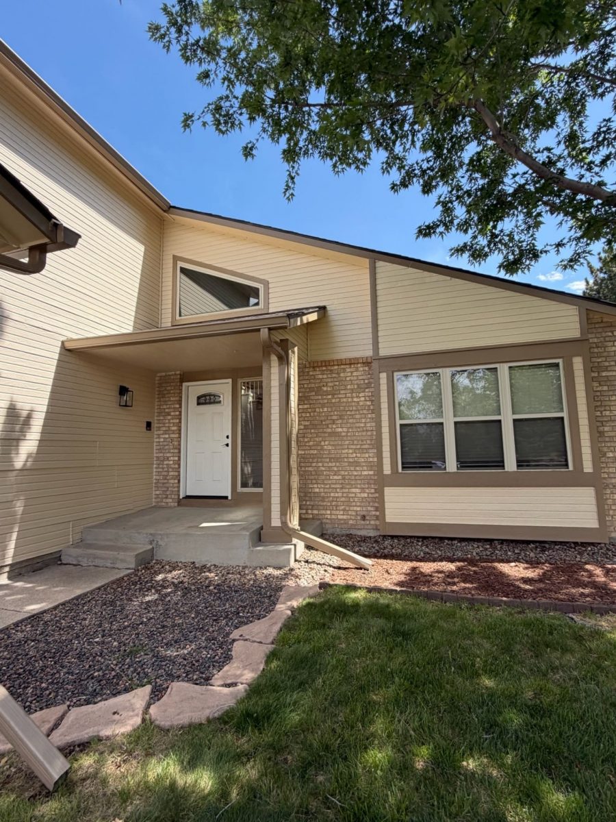 house exterior with beige siding and brown trim