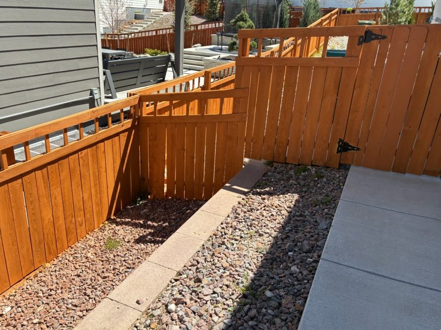 stained fence surrounding house Preview Image 1