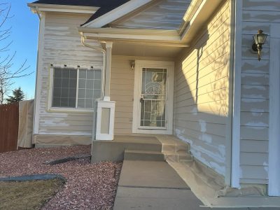 house exterior primed for repaint