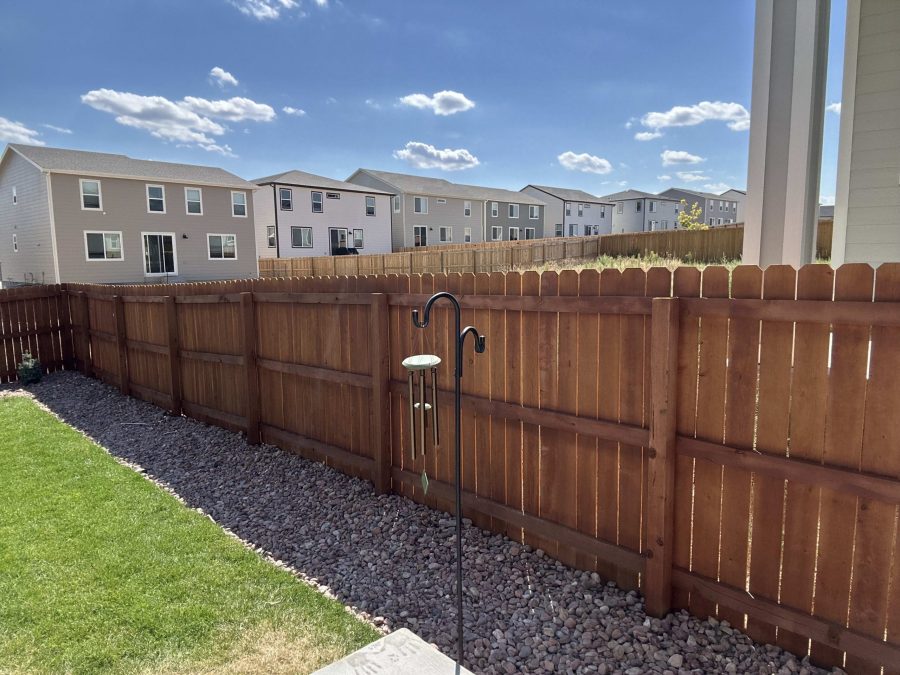 stained wooden fence surrounding yard