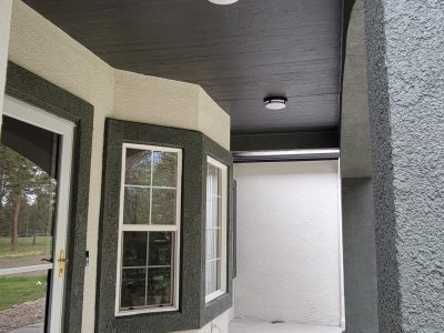 two tone painted stucco covered front porch
