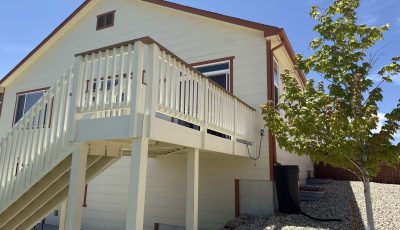 white painted deck attached to house
