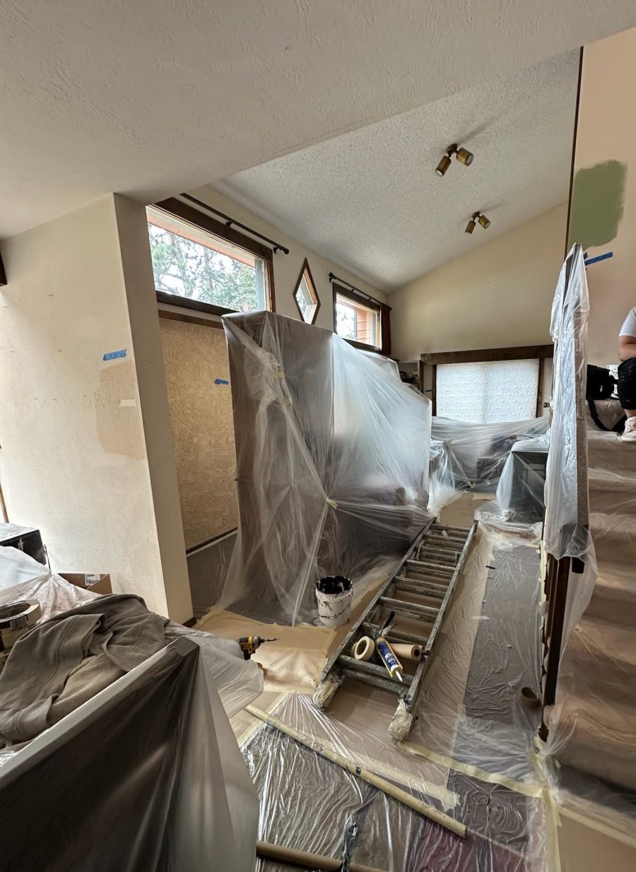 house interior with paint prep coverings