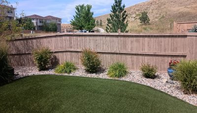 stained fence in neutral color surrounding yard