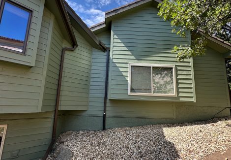 house with green painted siding