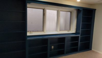 blue painted built-in shelves