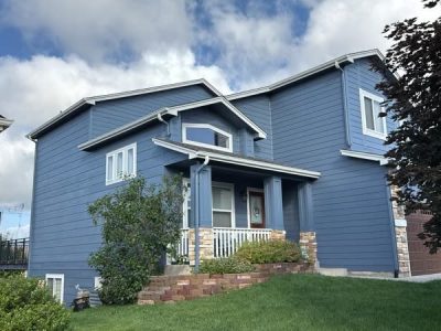 front of house with blue painted siding