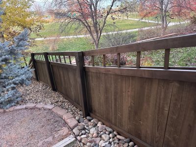 wooden fence with dark stain