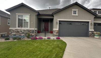 front door and garage of painted twin house with driveways