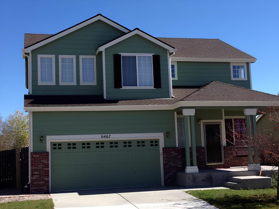 Two Story Green Exterior in Stetson Hills, CO