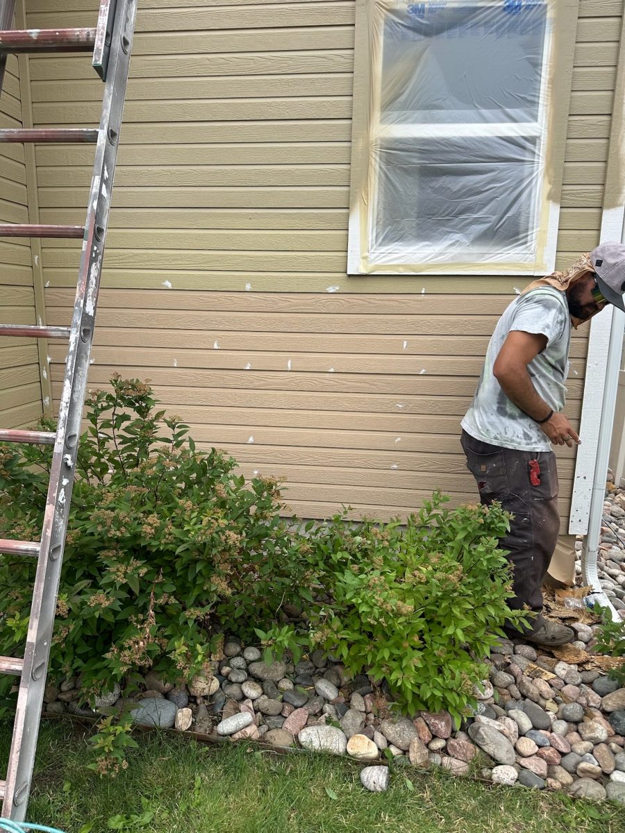 exterior wall with siding repair in progress