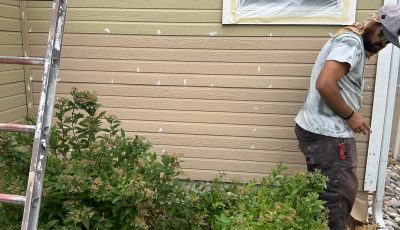 exterior wall with siding repair in progress