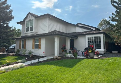 home with stained wooden shutters