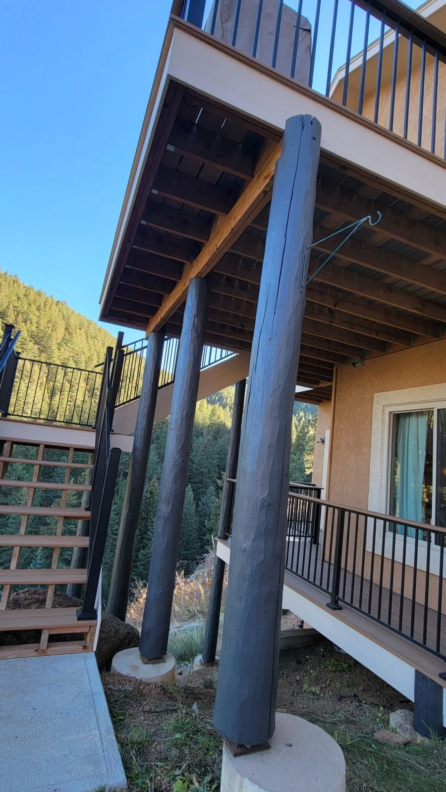 blue painted support beams outside home Preview Image 1