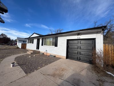 white exterior black trim and garage