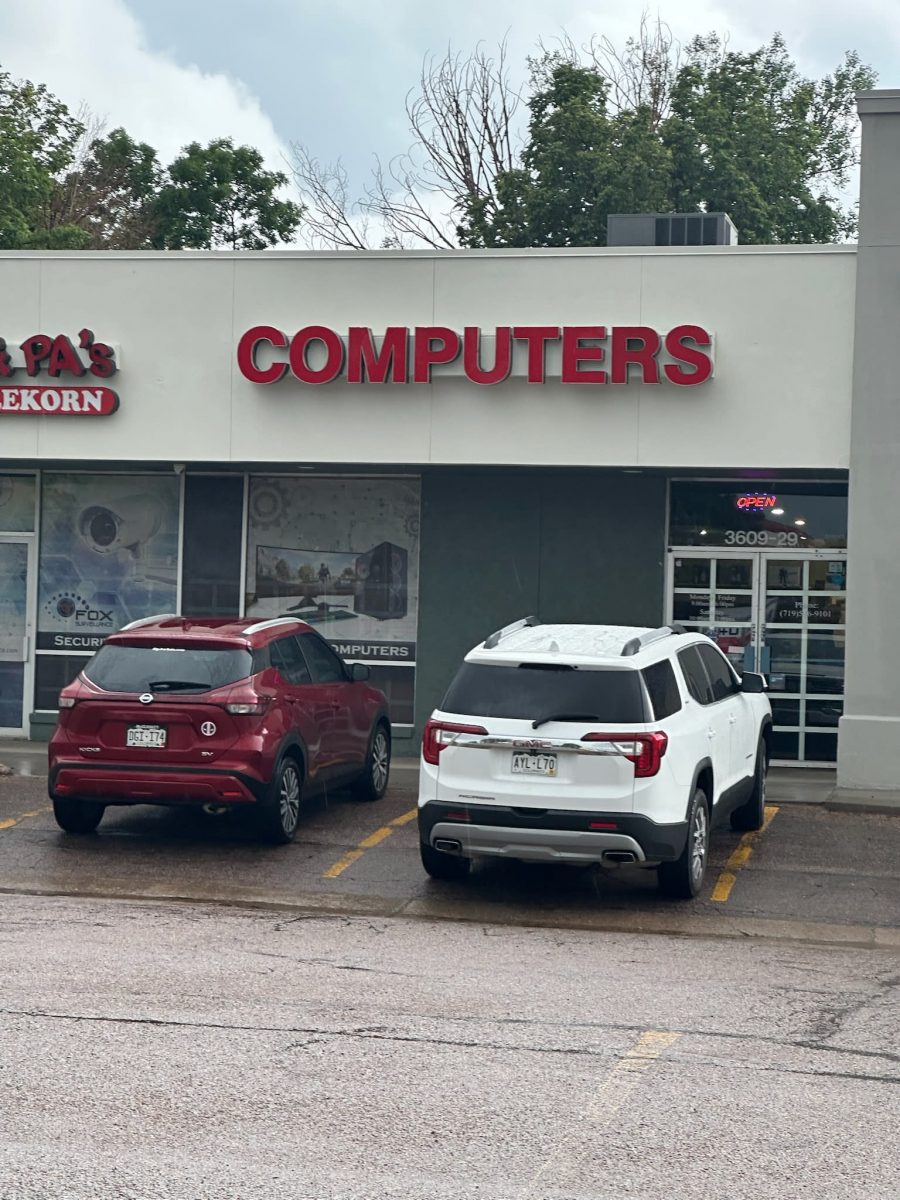 parking lot and storefronts of painted shopping center Preview Image 3