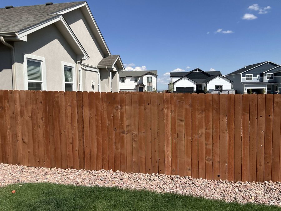 stained wooden fence surrounding yard Preview Image 4