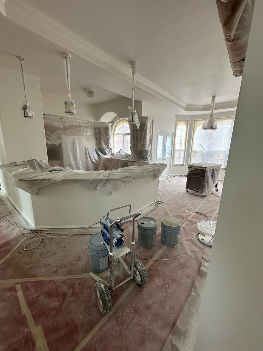 home interior with protective plastic during paint project