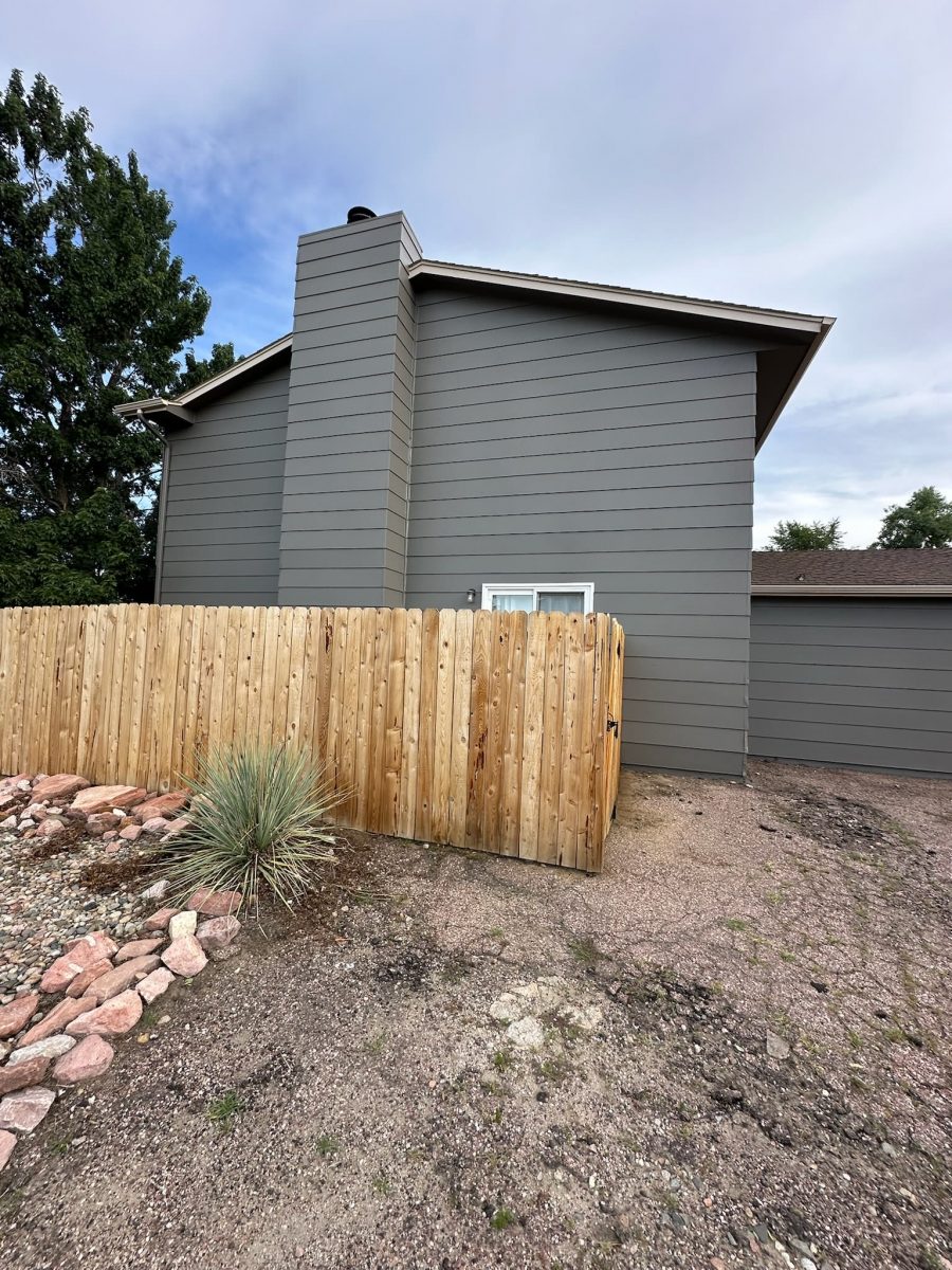 home with grey siding and wooden fence Preview Image 3
