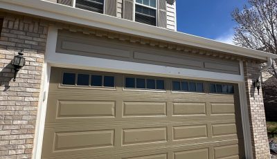 house exterior with painted garage and shutters