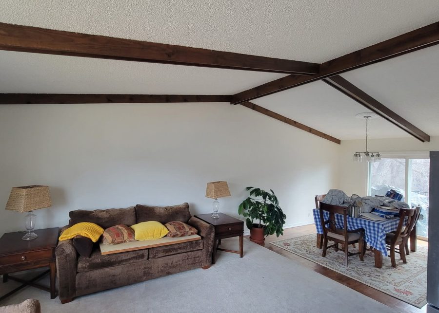 white home interior with exposed beam ceiling