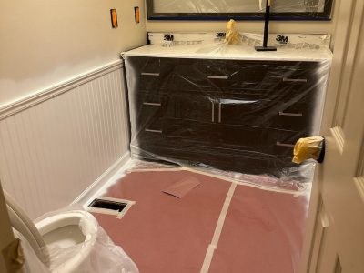 home bathroom with protective coverings for a paint project