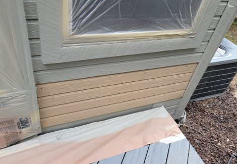 siding with replaced boards before painting