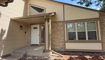 house exterior with beige siding and brown trim