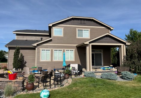 back of house with painted siding