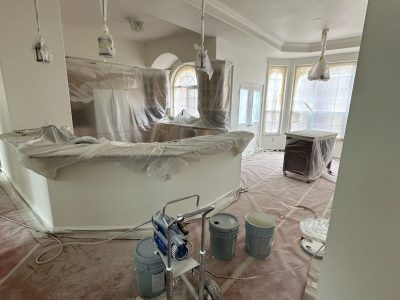 home interior with protective plastic during paint project