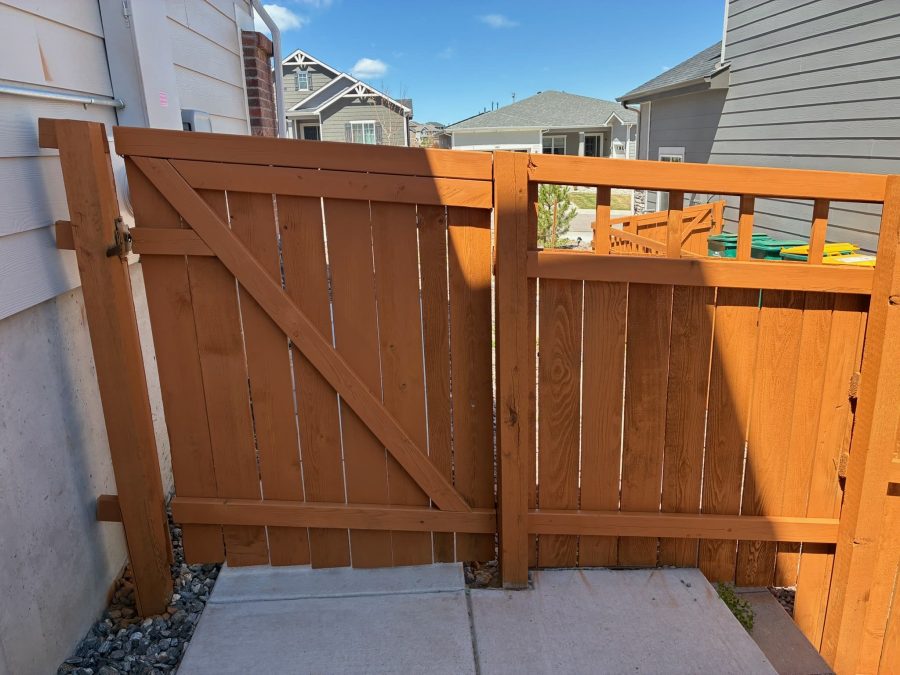 stained fence surrounding house Preview Image 3