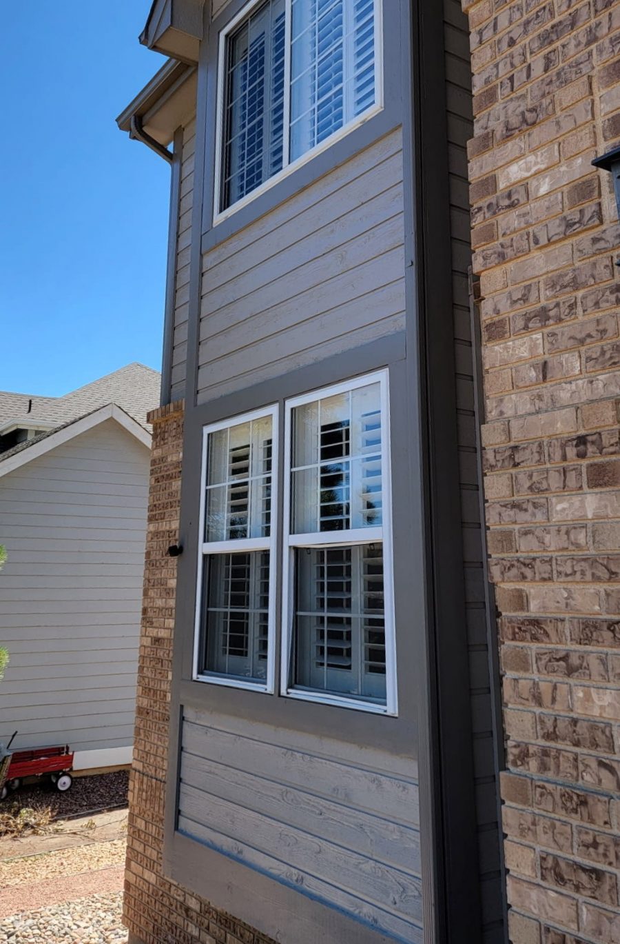 front window of house with repainted siding and brick Preview Image 4