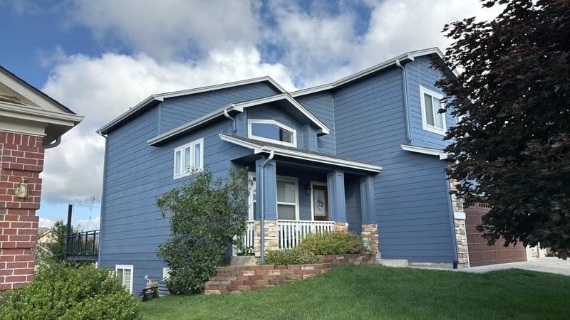 front of house with blue painted siding