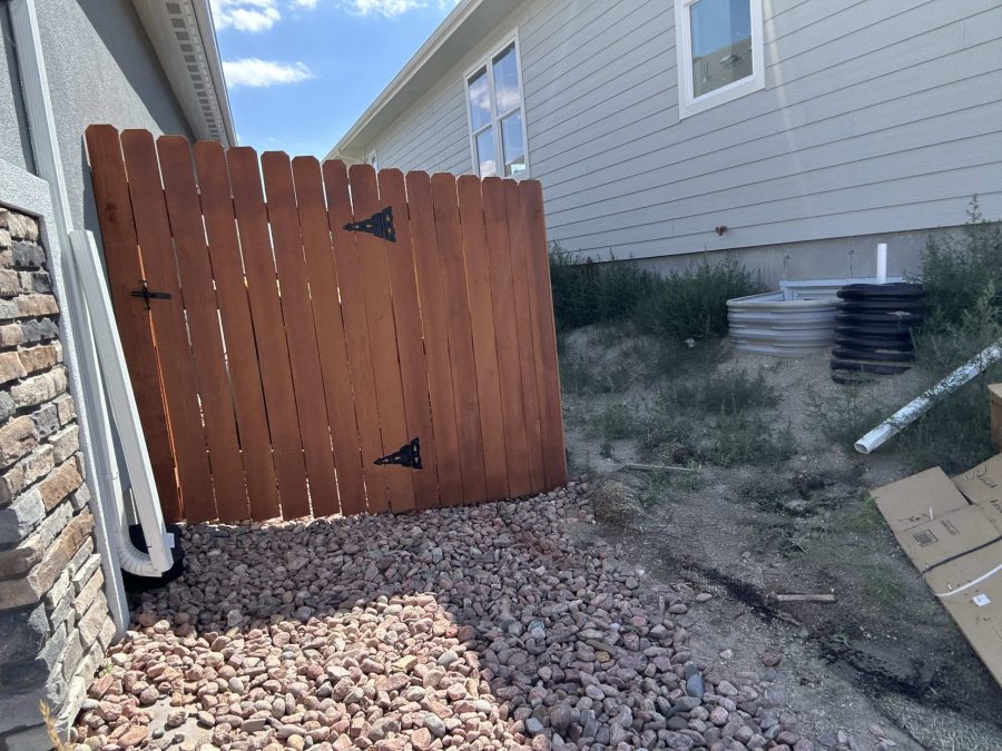 stained wooden fence surrounding yard Preview Image 2