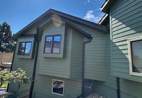 house with green painted siding