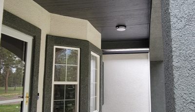 two tone painted stucco covered front porch