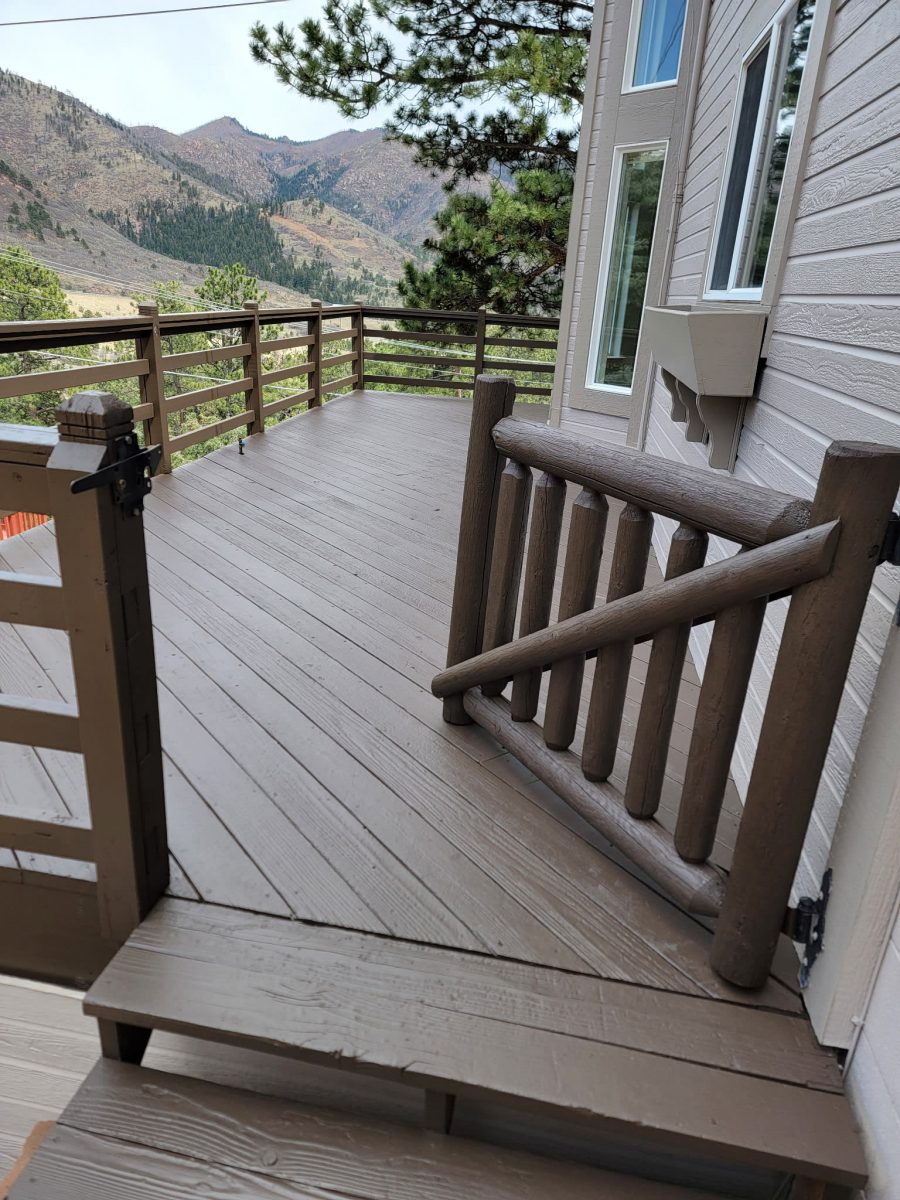 dark brown painted wooden deck attached to home Preview Image 1