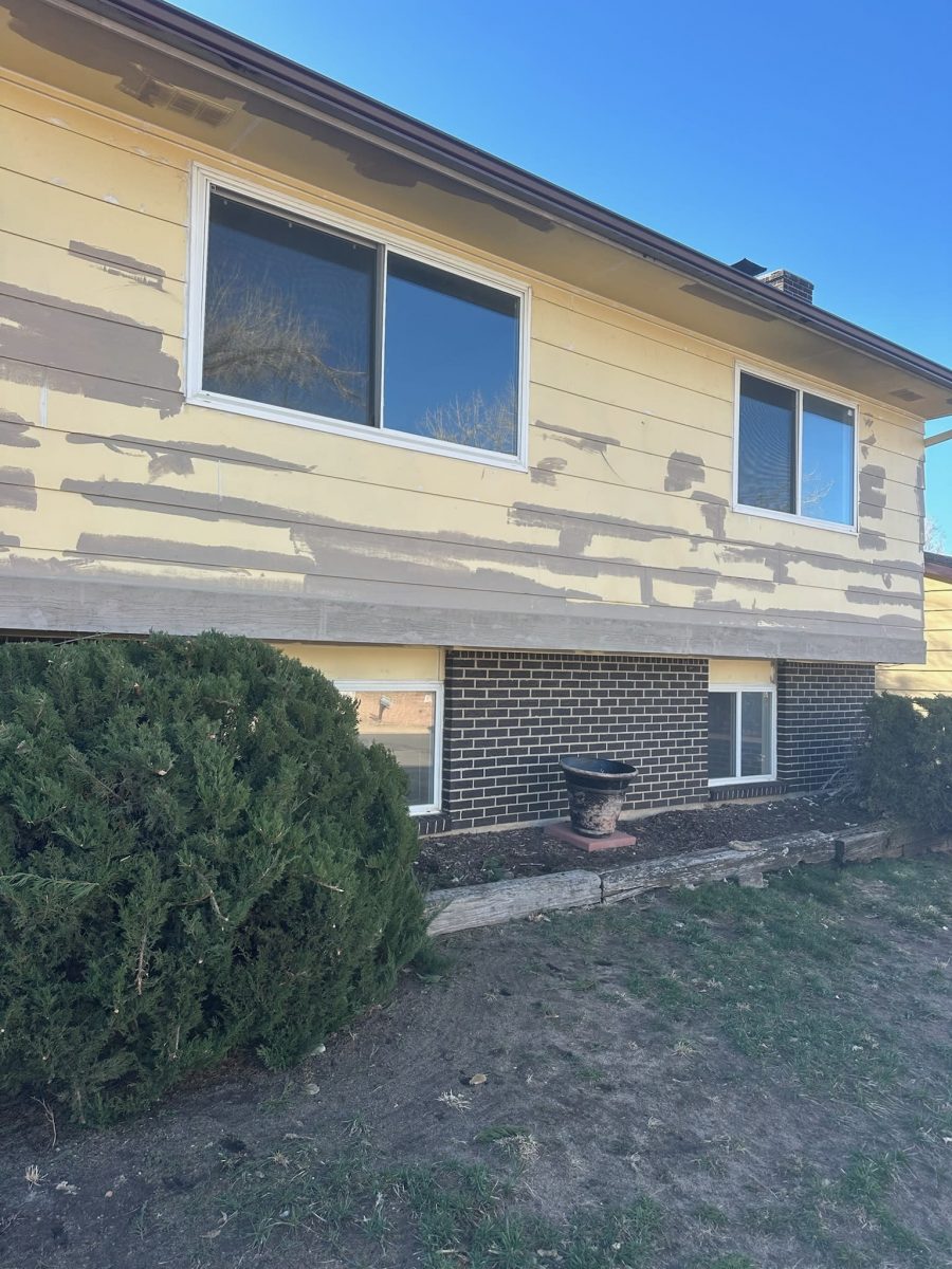 house with yellow siding during repaint Preview Image 4