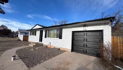 white exterior black trim and garage