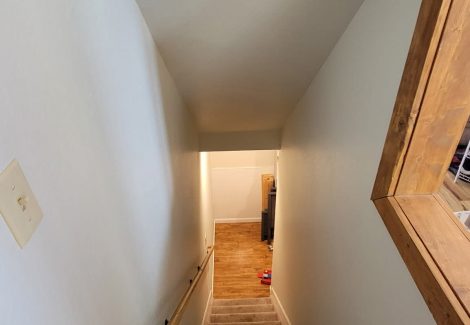 white painted staircase wall