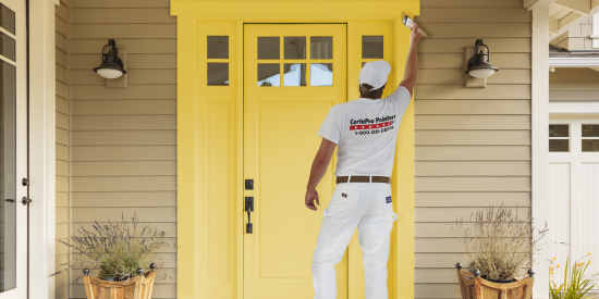 CertaPro Painters® painting front door yellow