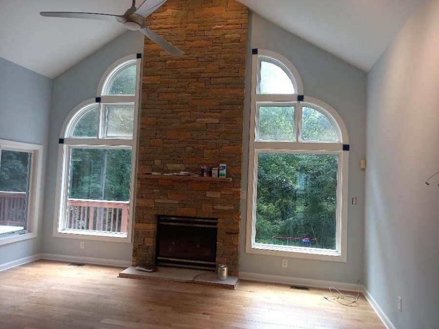 This room was painted a grey color that highlights the natural light of the space.