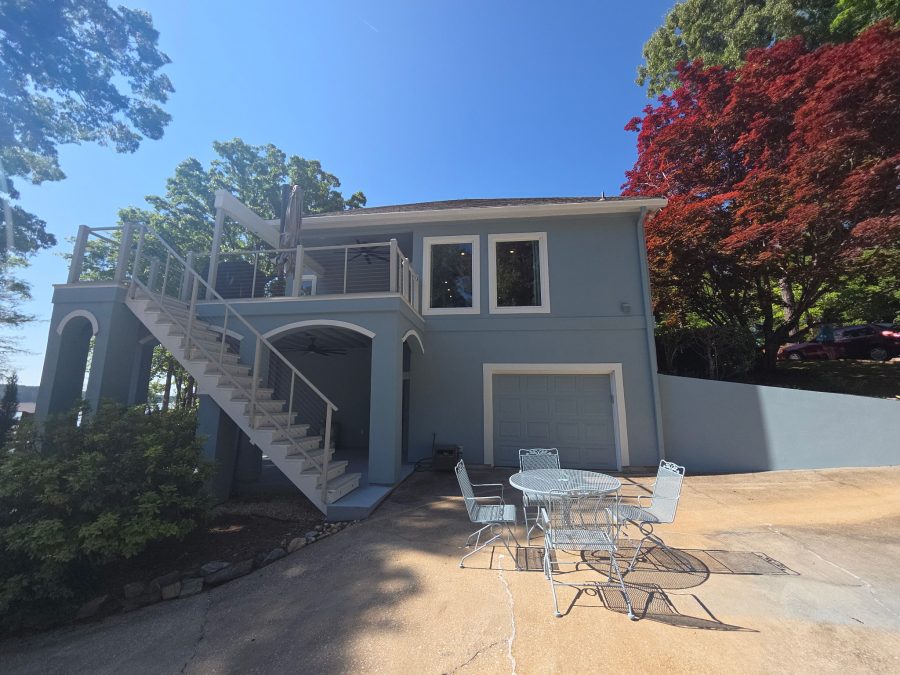 house exterior painted light blue with white window and garage trim Preview Image 3