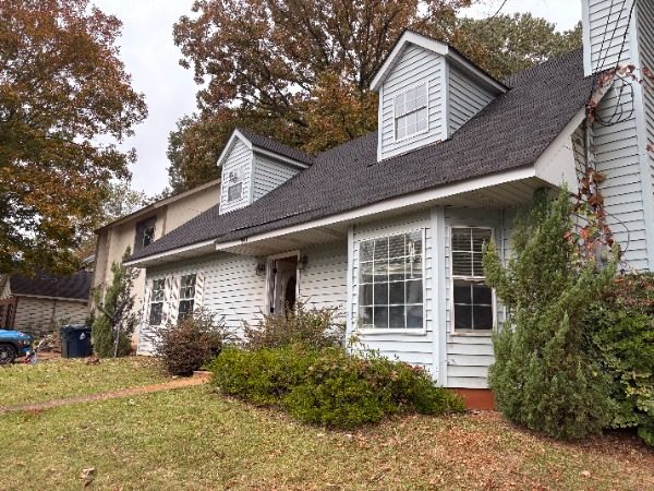 house exterior with worn white siding Preview Image 8