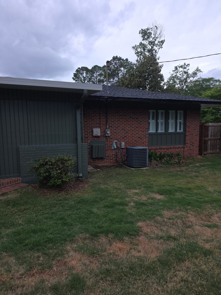 brick house with dark green painted siding and accents Preview Image 3