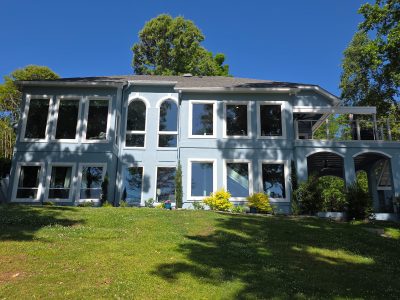 house exterior painted light blue with white window trim